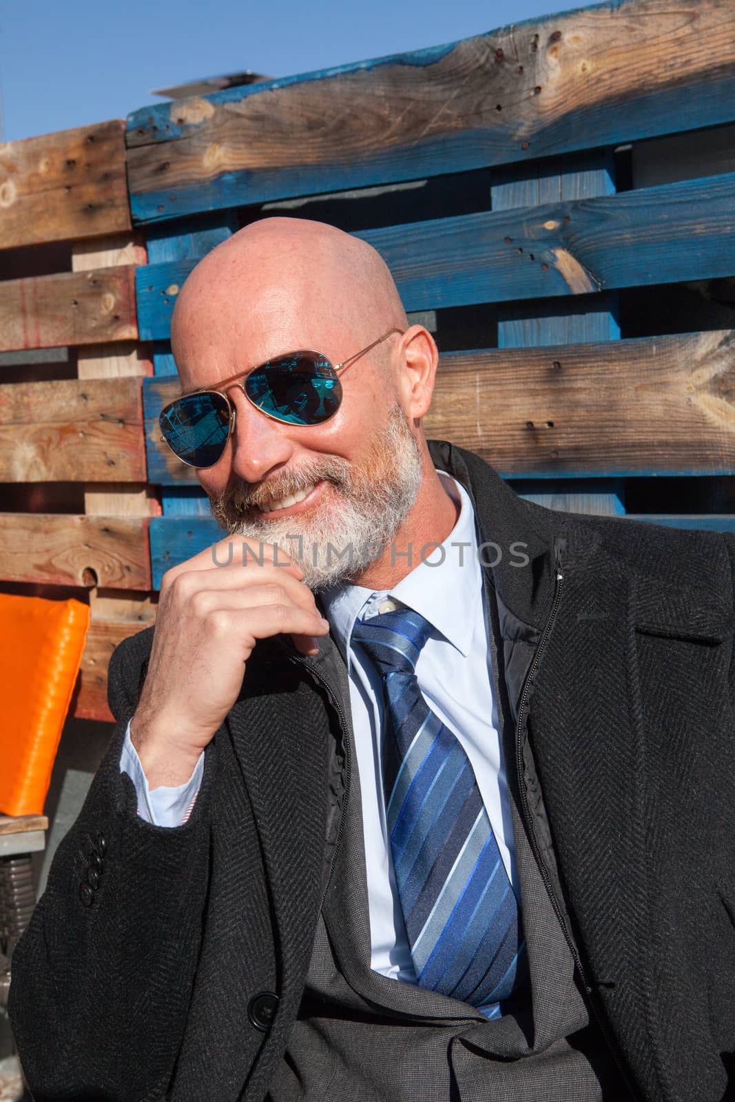 Middle-aged man , handsome and elegant working outside the office in a relaxed atmosphere