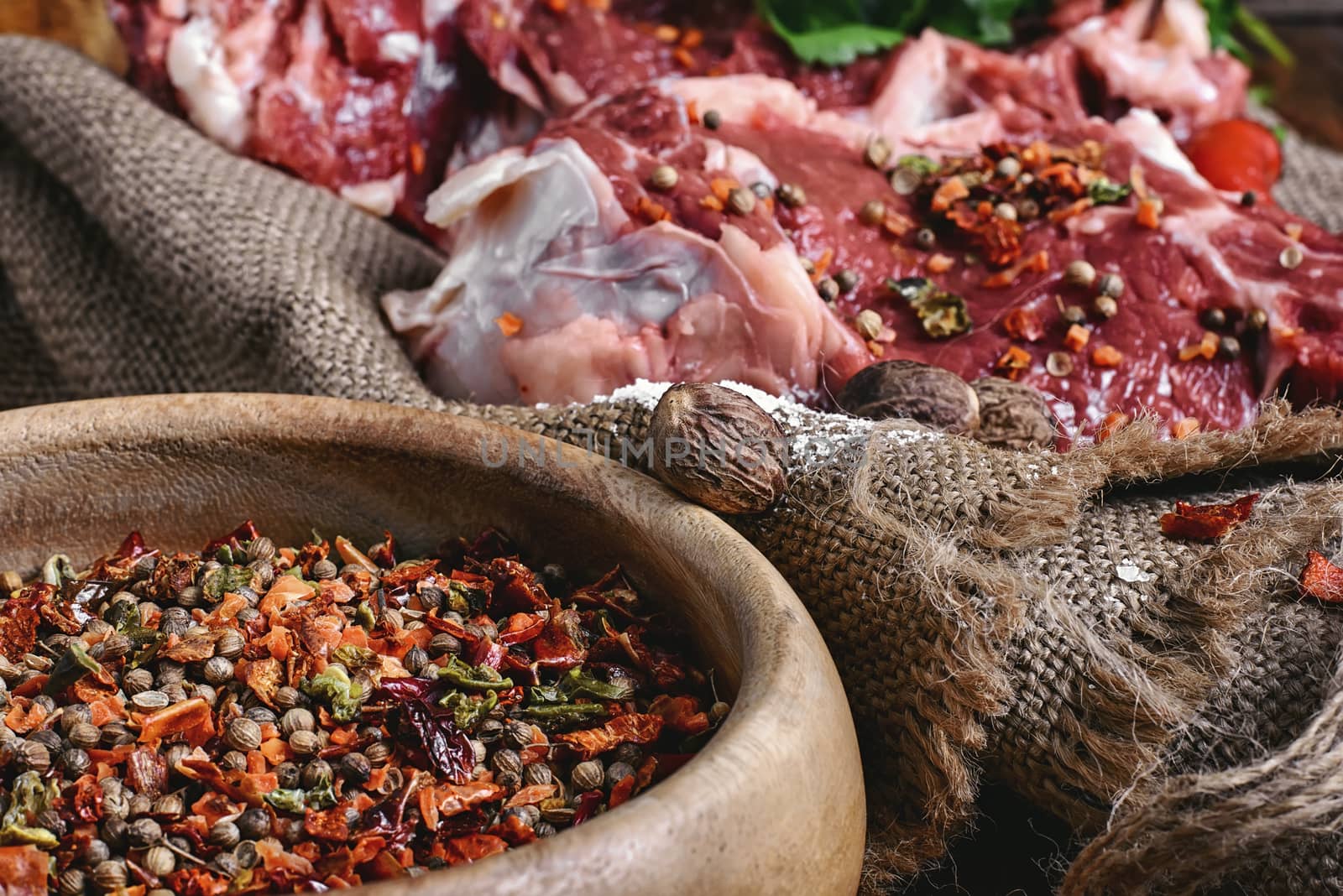 slice of raw meat in the seasoning is prepared for cooking