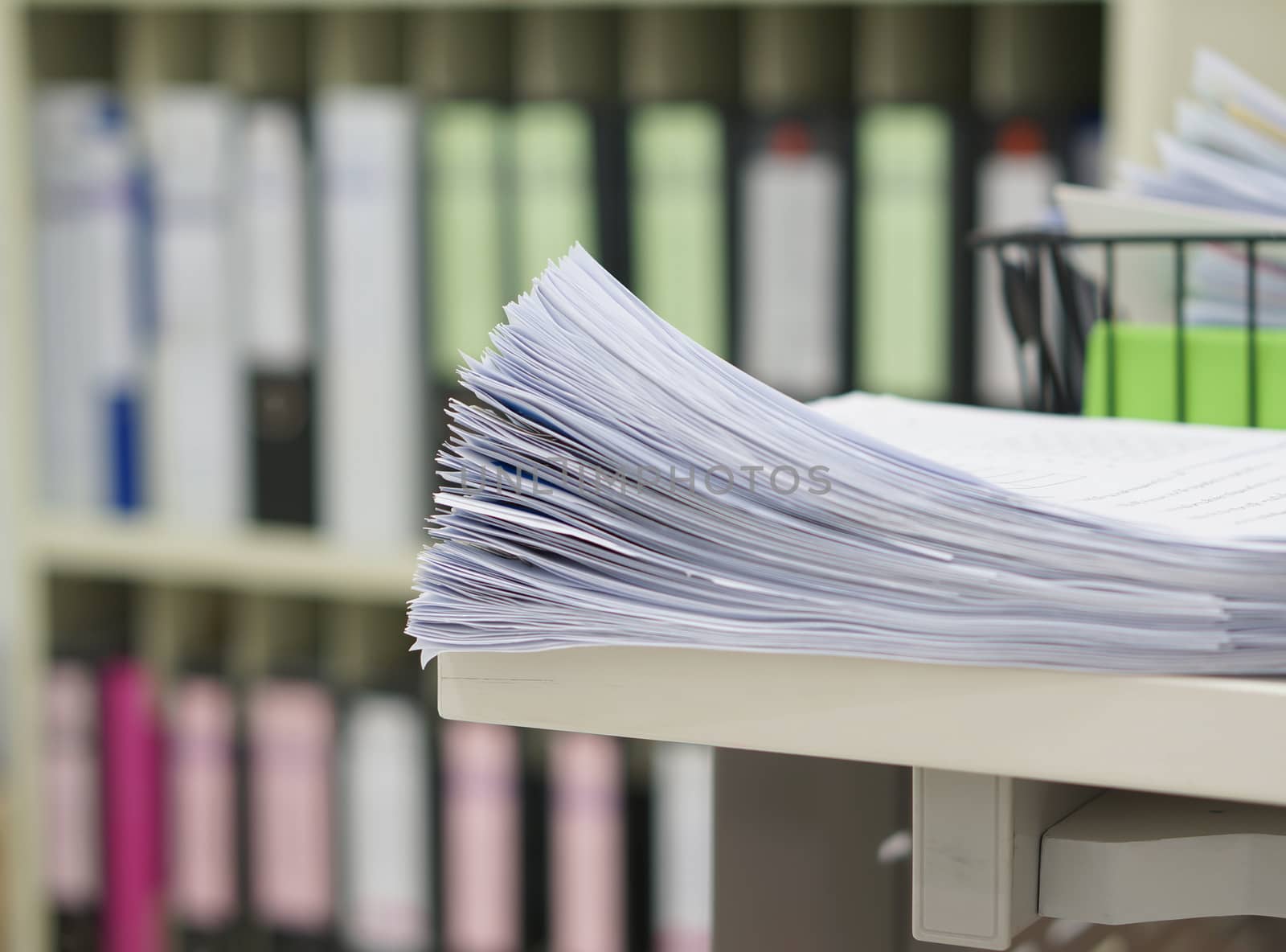 Many of data work and office supplies in office room.