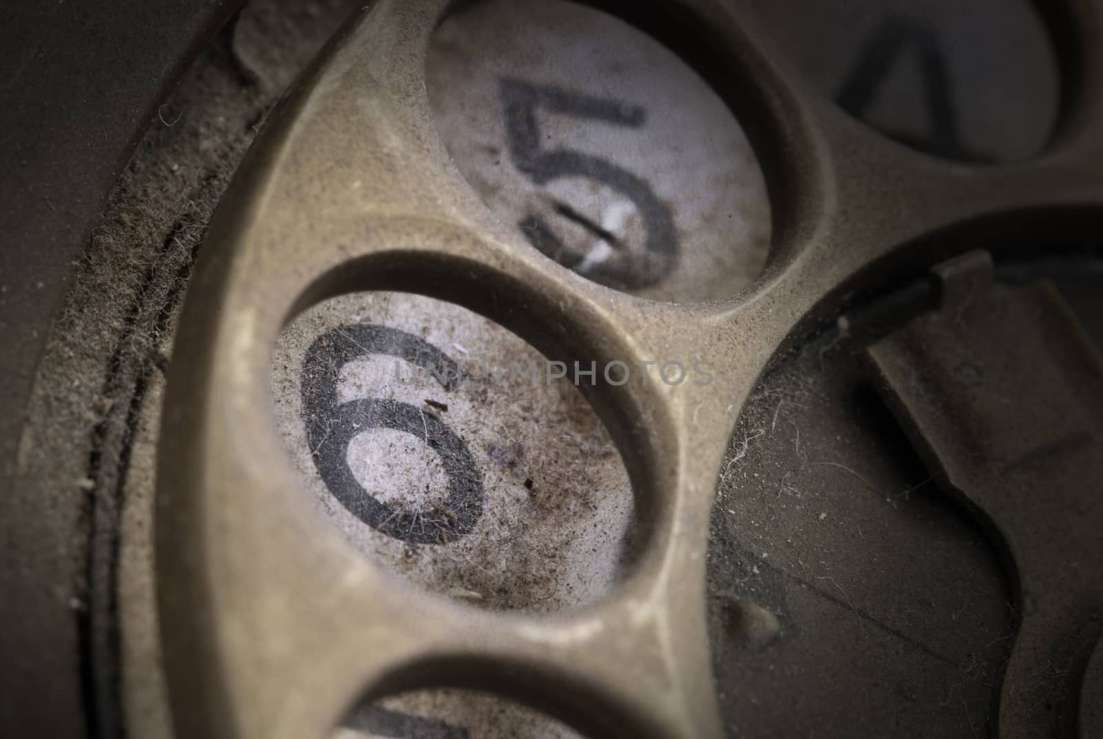 Close up of Vintage phone dial, dirty and scratched - 6, perspective