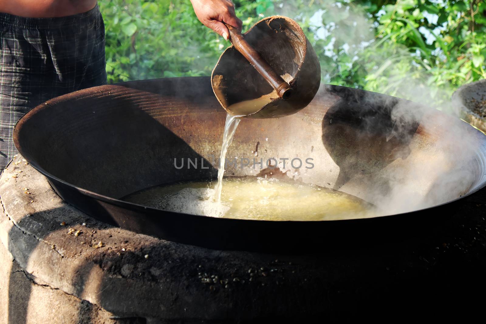 Vietnamese people process mussel, they cook seafood in boil water by firewood, mussel in famous food in Hoian, Vietnam