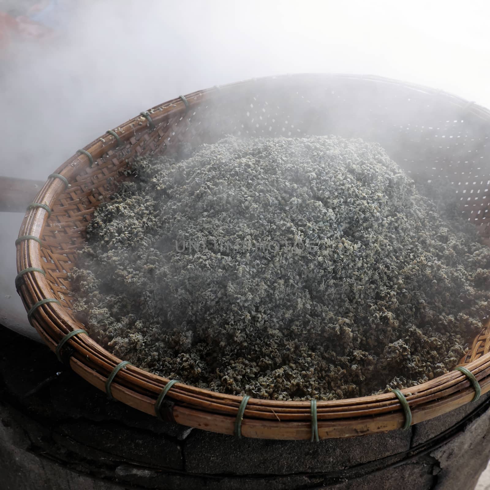 process mussel, cook seafood in boil water then sift mussel pulp from sell, mussel is famous food in Hoian, Vietnam