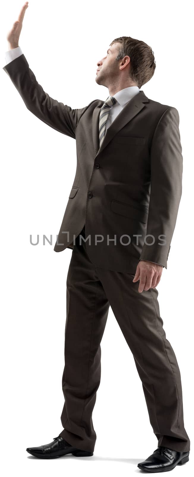 Businessman protecting himself with hand up in defensive position isolated on white background