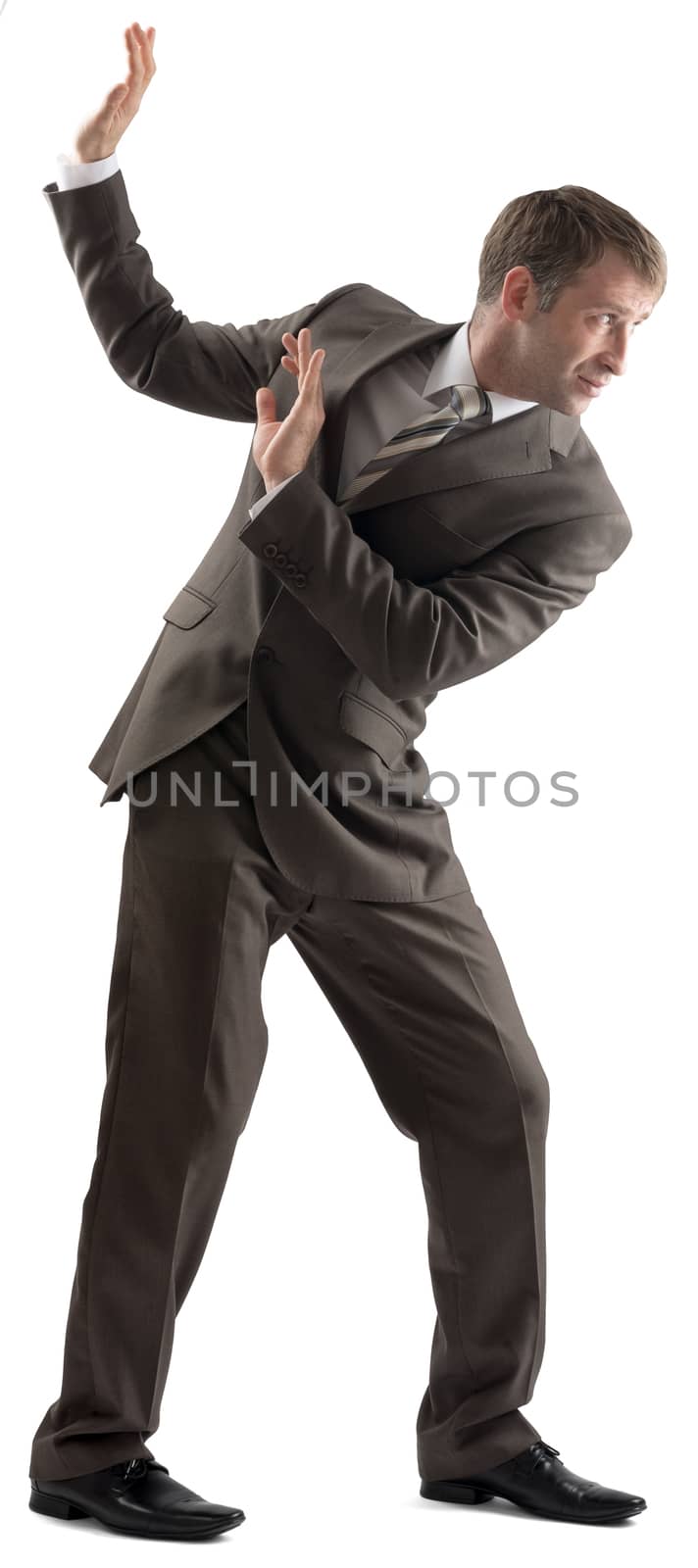 Shocked businessman protecting himself with hands on white background
