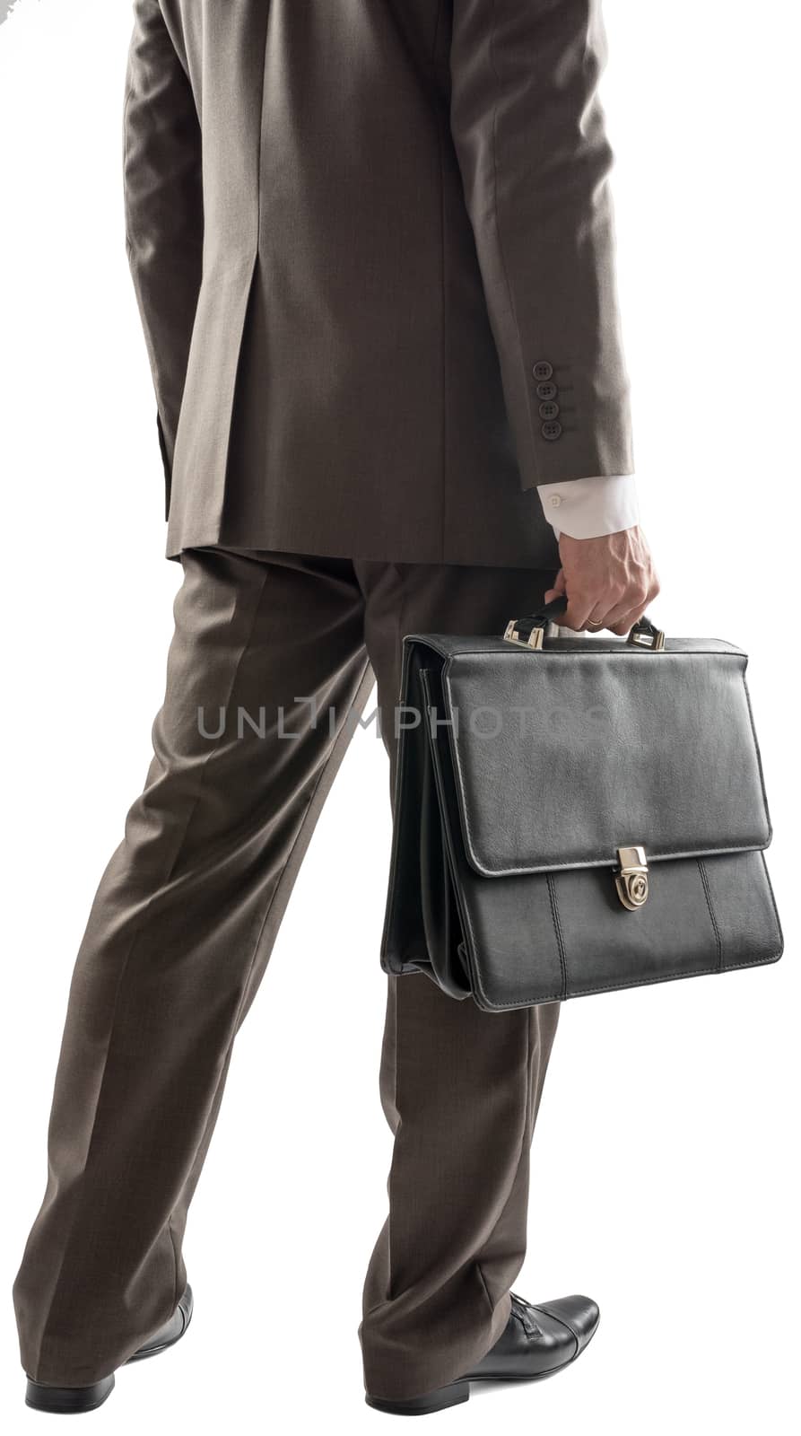 Back view of businessman with suitcase in hand, close up view