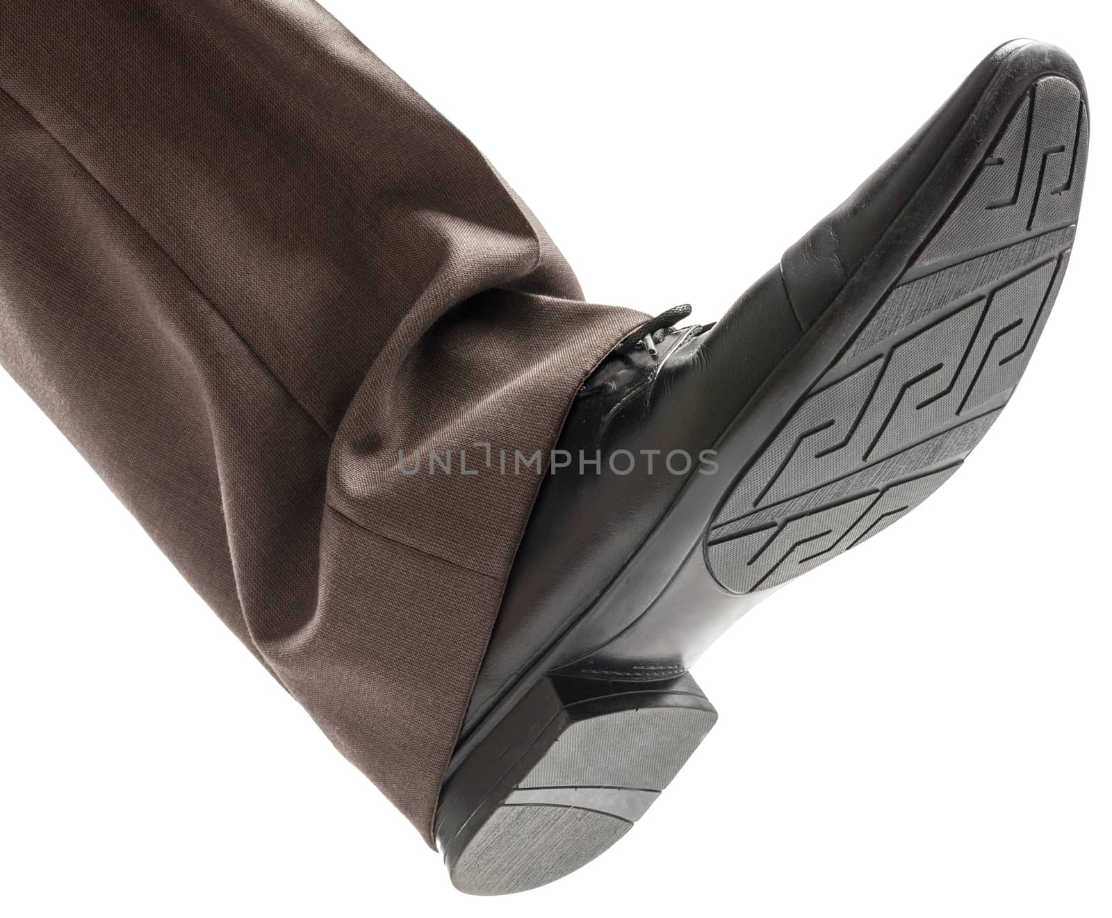 Businessmans foot ready to step down isolated on white background