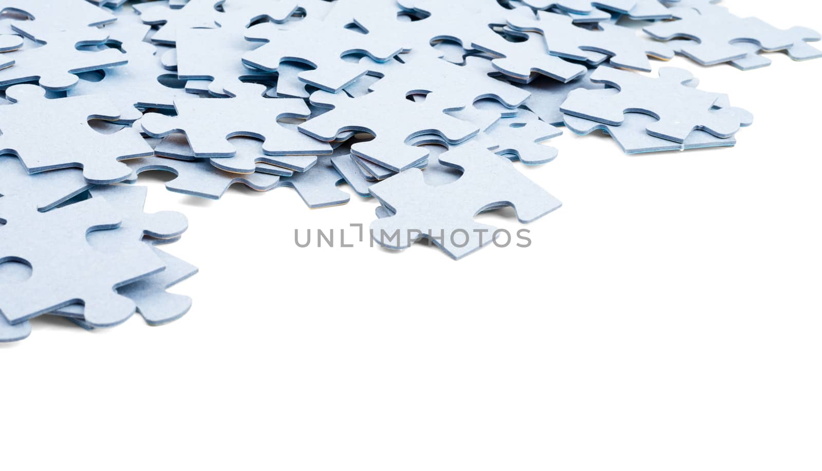 Grey puzzle pieces isolated on white background