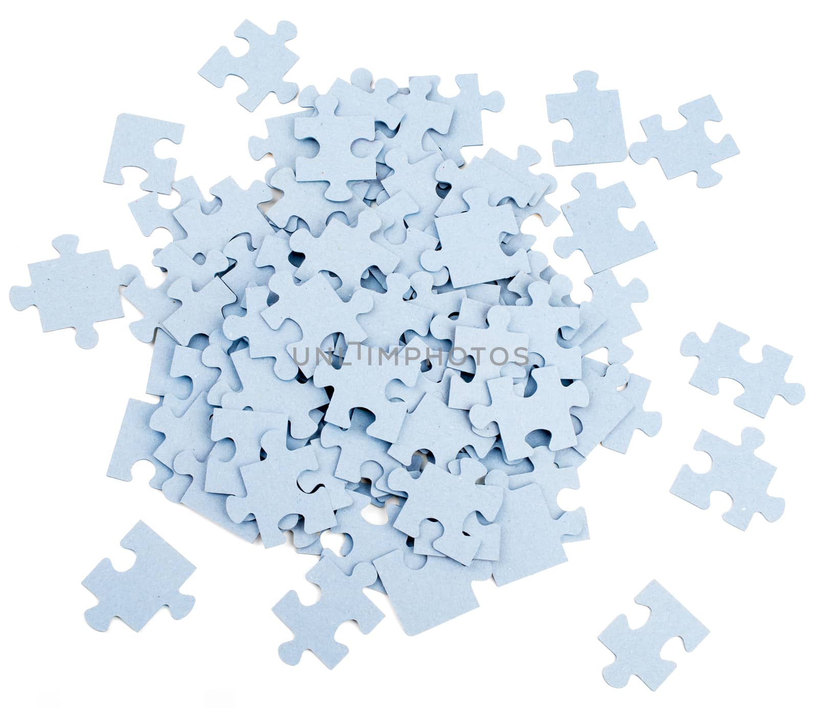 Pile of grey blank puzzle pieces isolated on white background, top view
