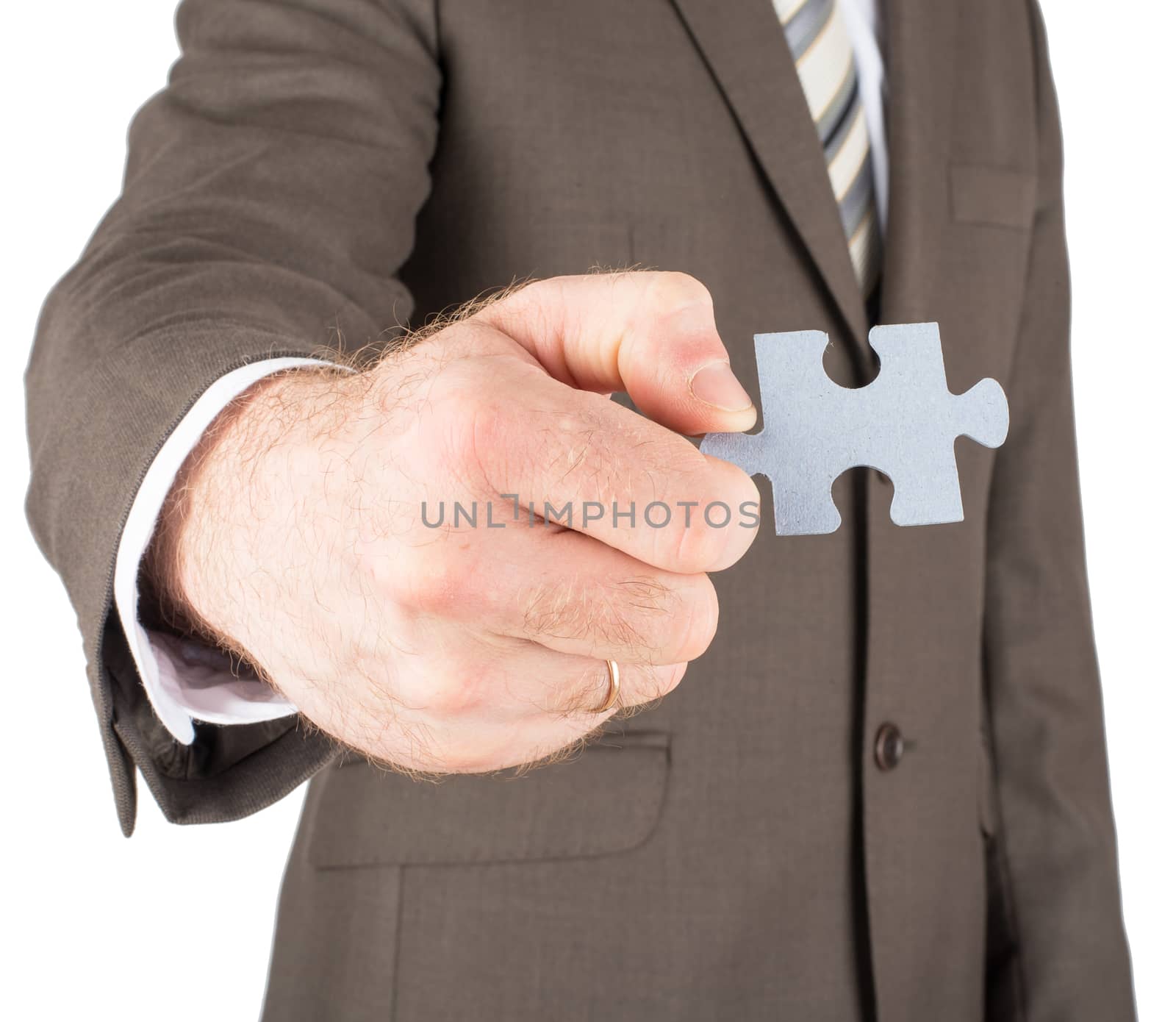 Businessman holding puzzle piece isolated on white background