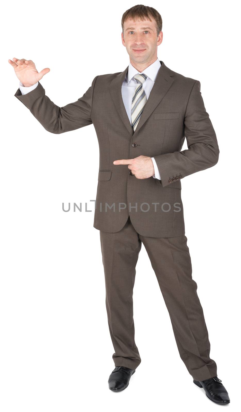 Bright entrepreneur pointing away while standing against white background