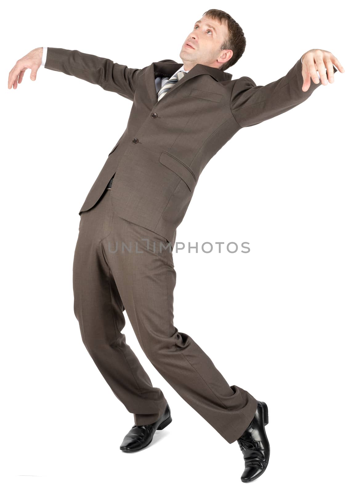 Falling businessman in formal wear over white background