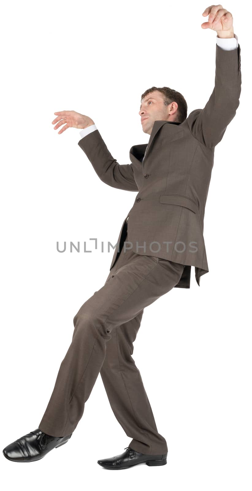 Businessman slipping on banana peel isolated on white background