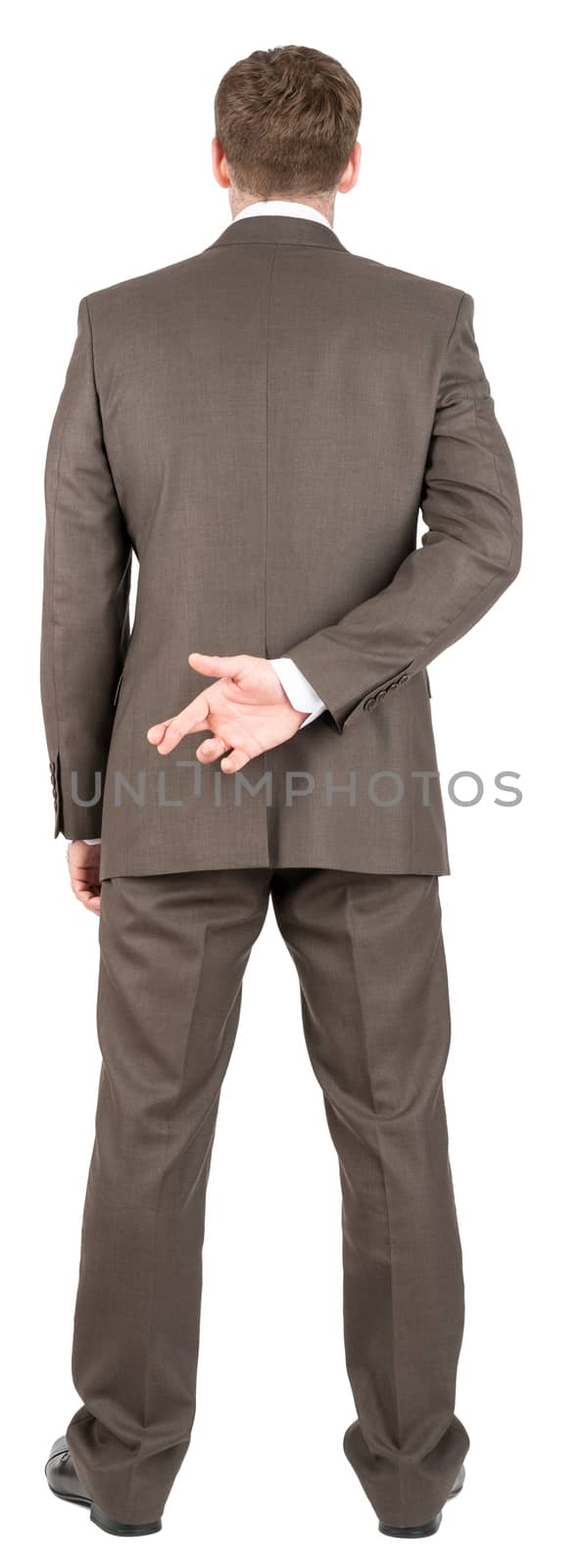 Businessman with his fingers crossed by cherezoff