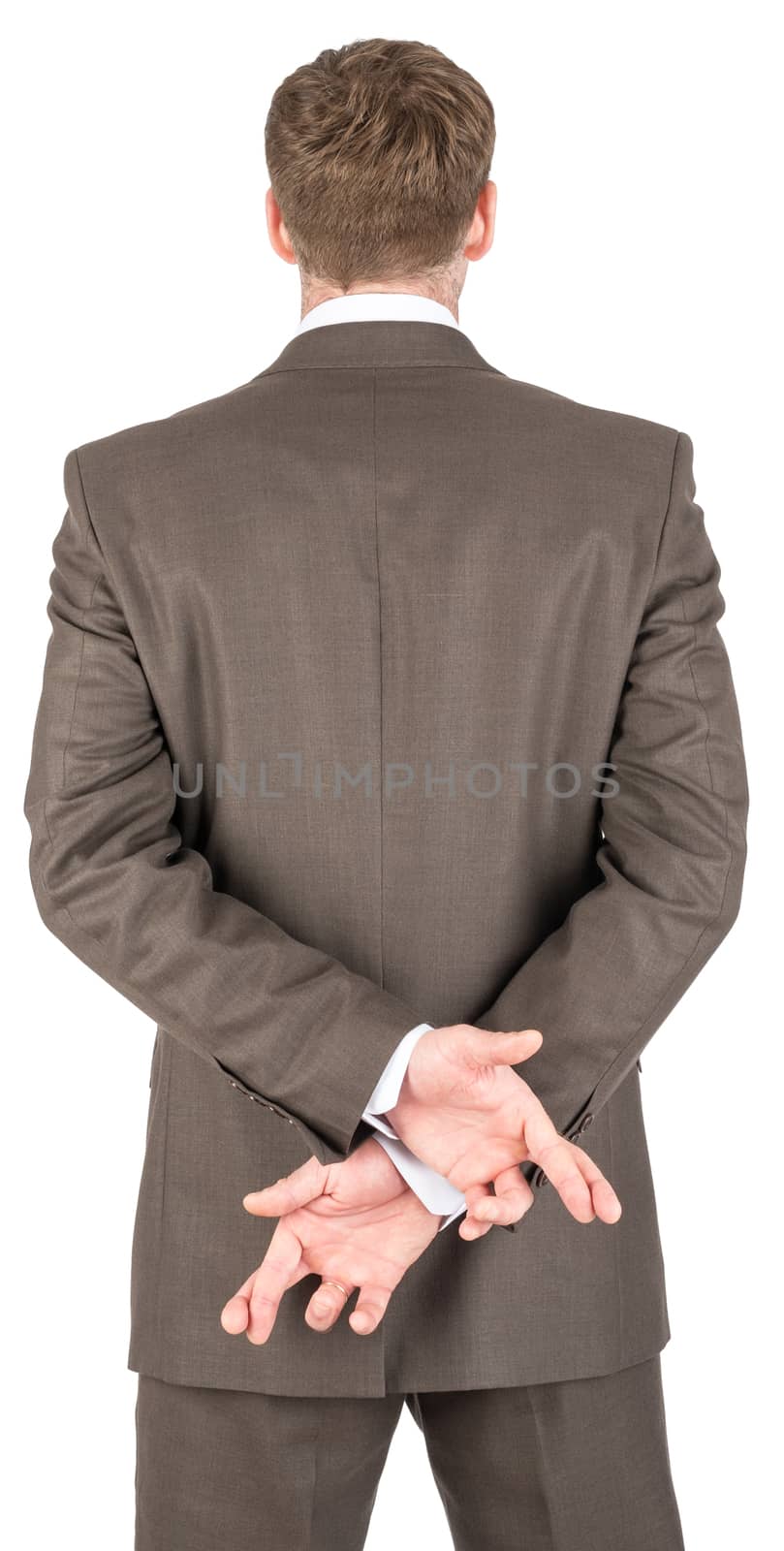 Businessman crossing his fingers behind his back isolated on white background