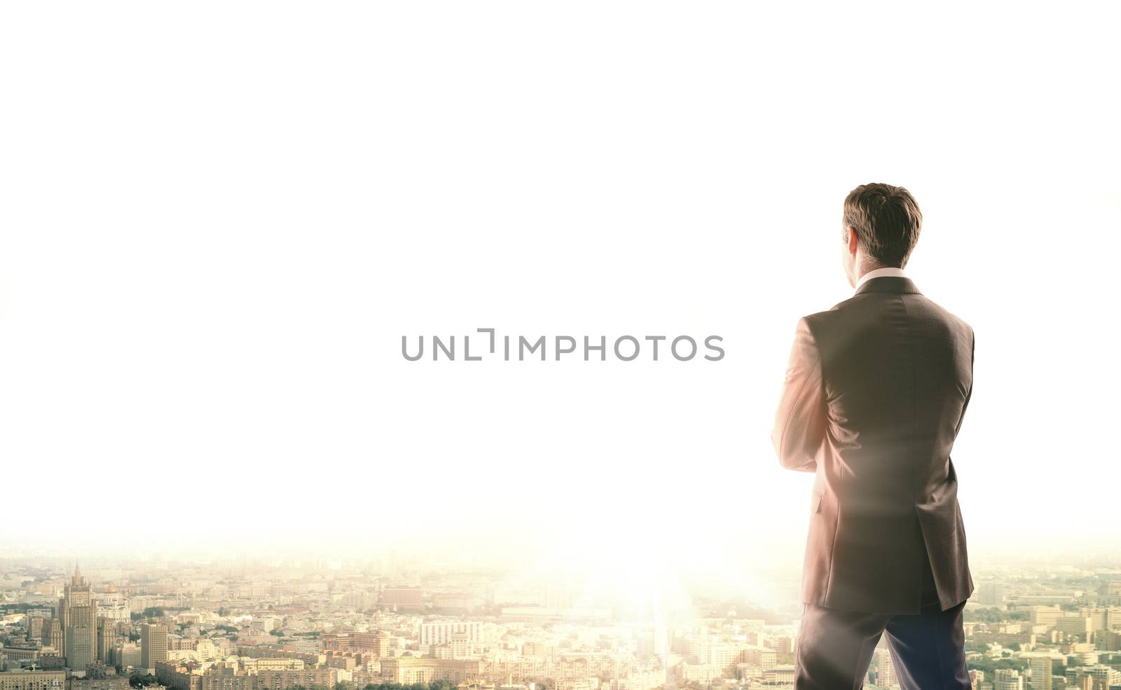 Business man looks sunrise in city, concept for business