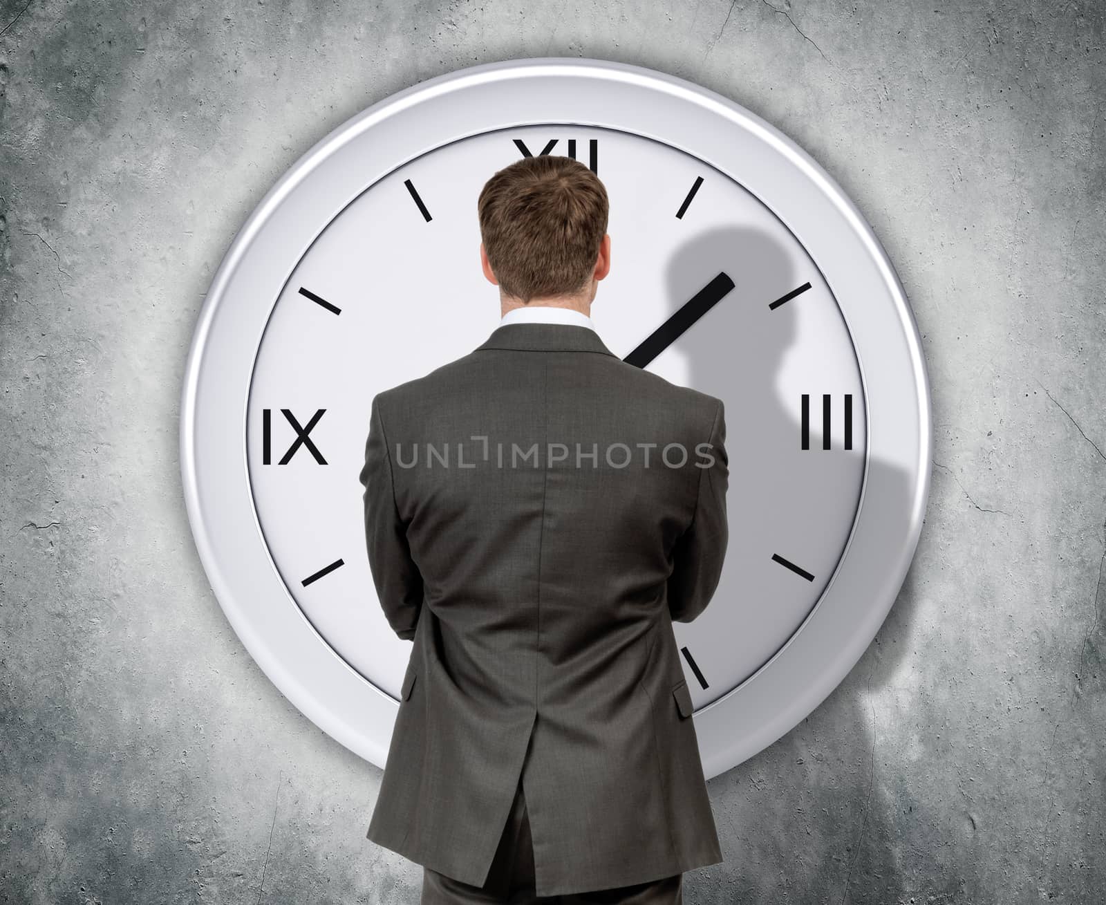 Businessman looking at clock by cherezoff