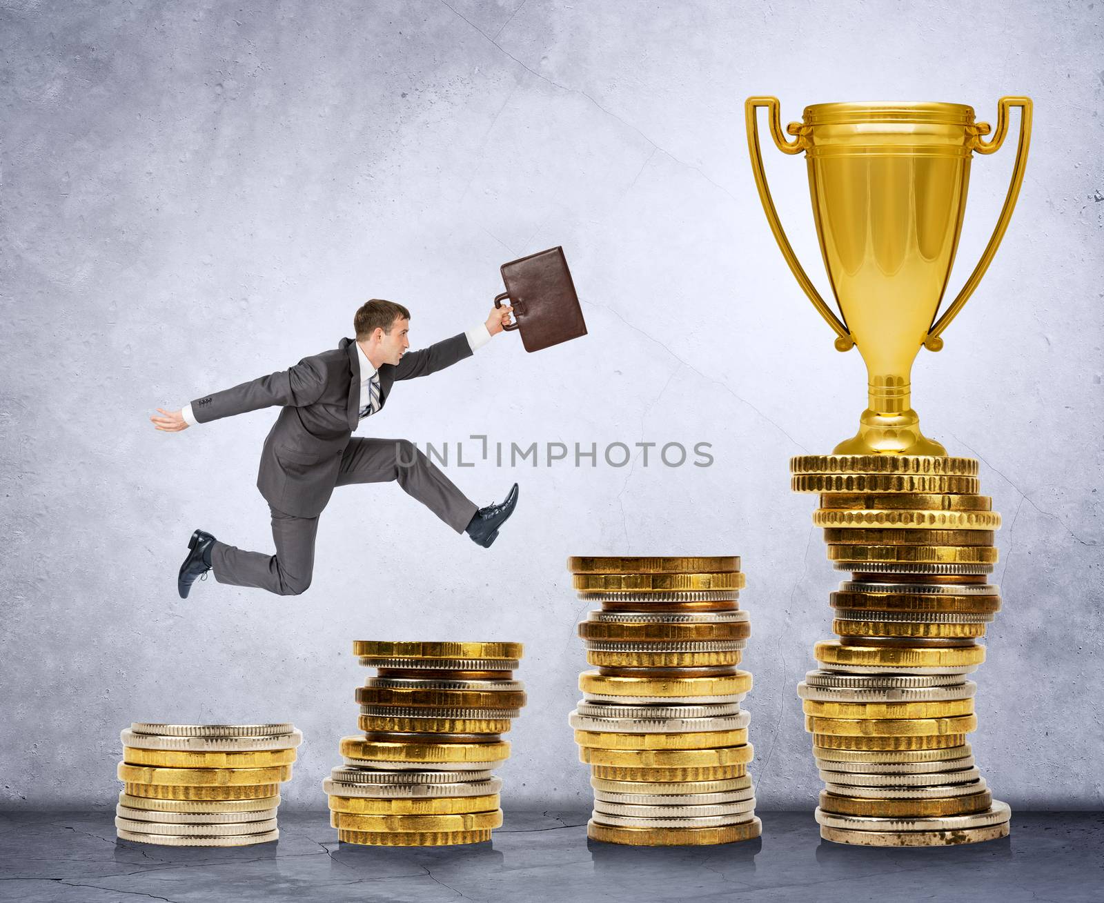Businessman running and jumping on money stairs to gold cup