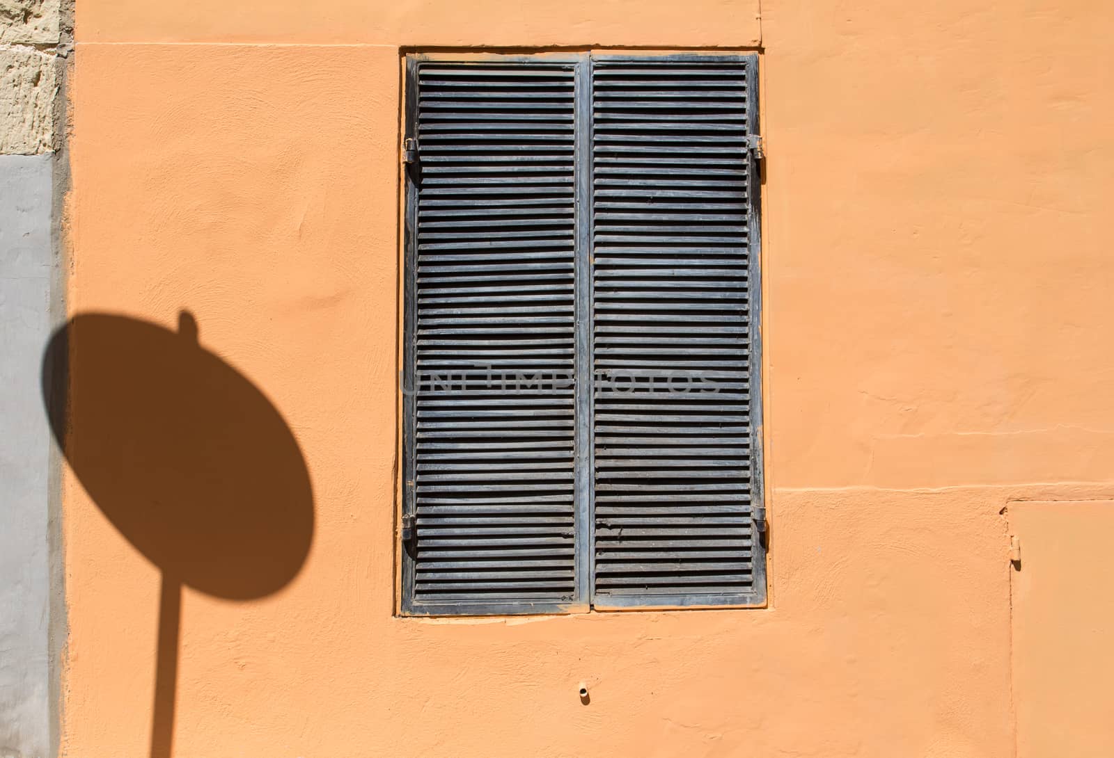 Window and a traffic sign shadow by YassminPhoto