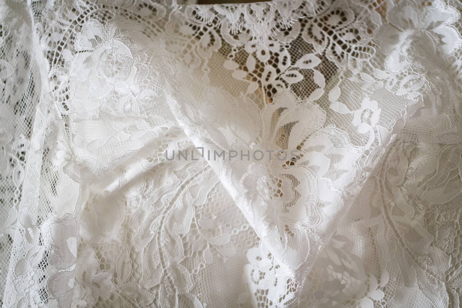 Detail of a white beautiful wedding dress