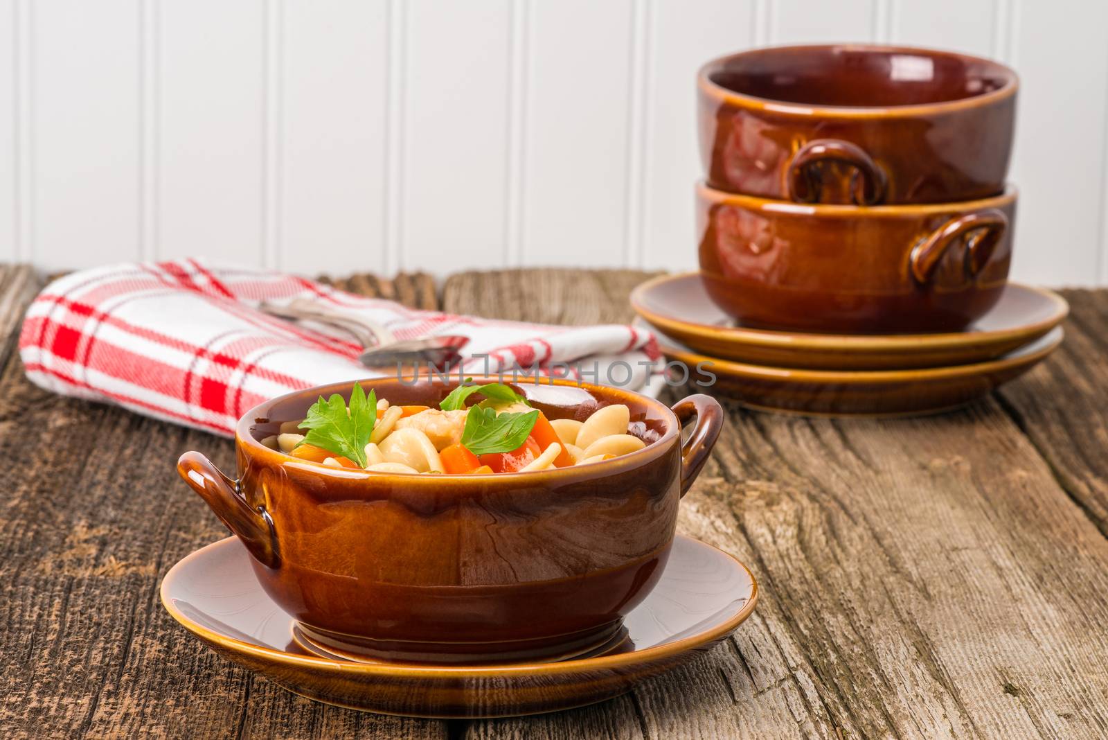 Bowl of hearty turkey soup made with leftover holiday meat.