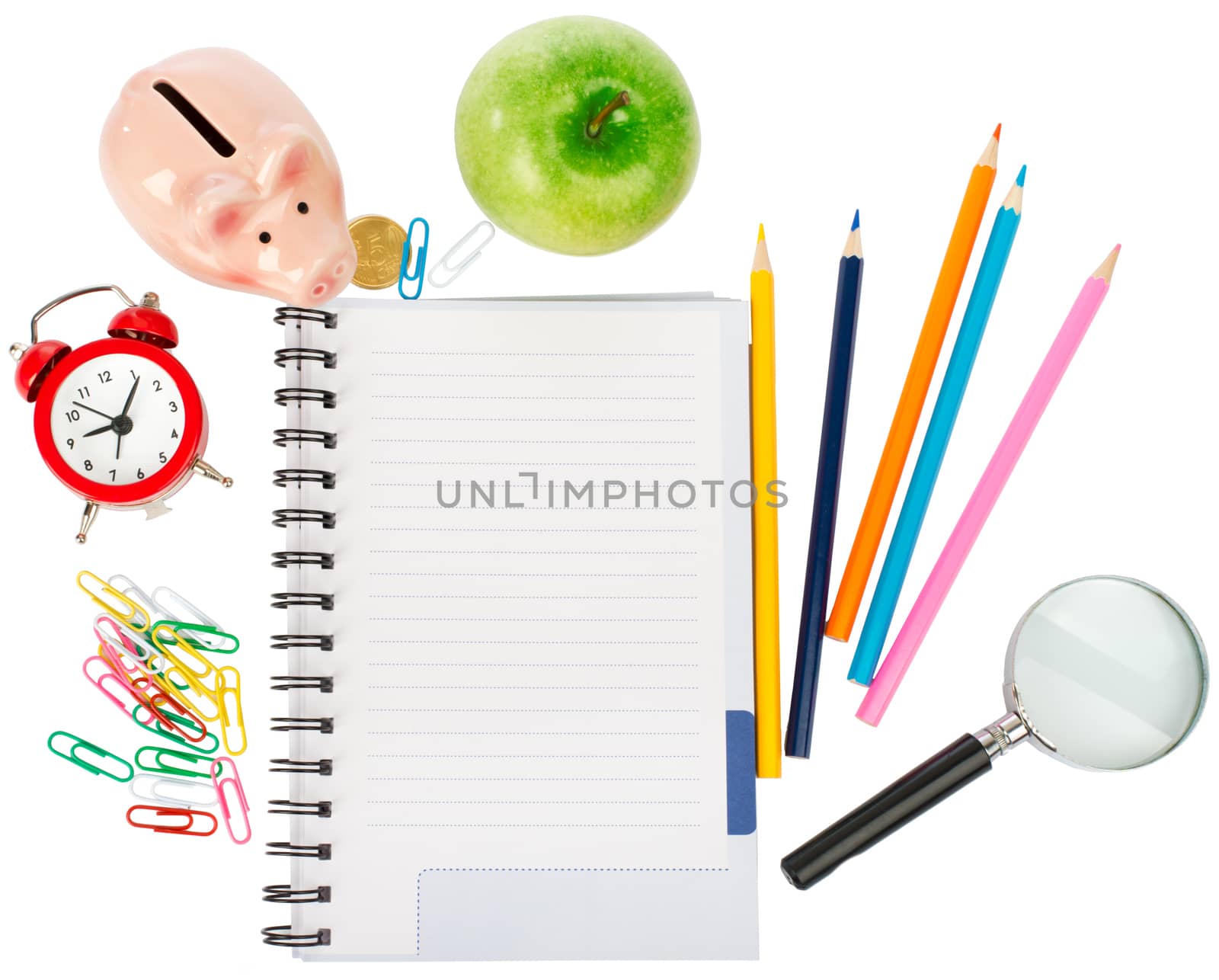 Open notebook with stationery and magnifier isolated white background, closeup