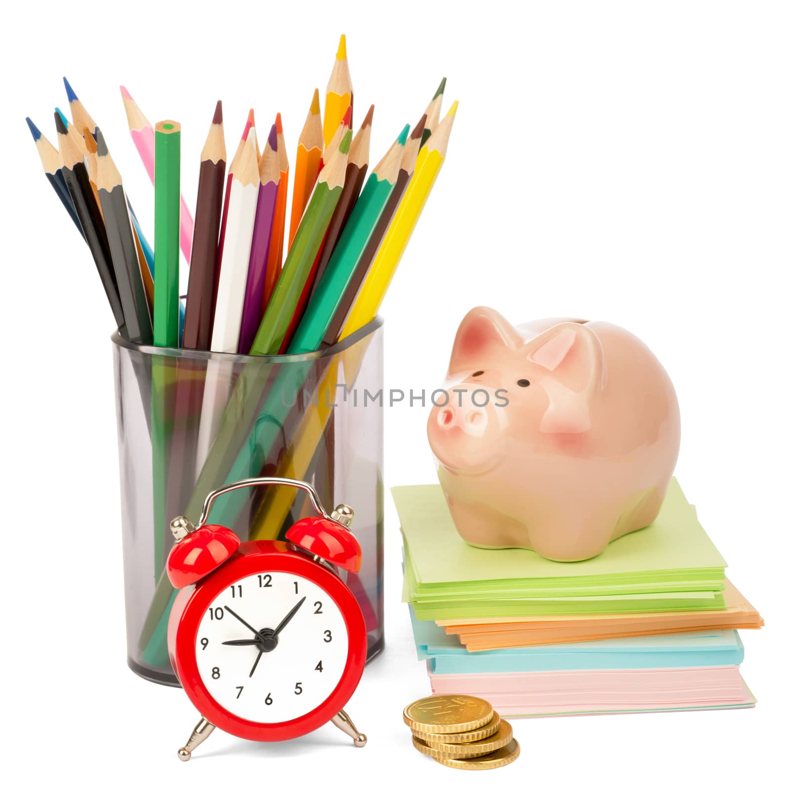 Alarm clock with piggy bank and crayons isolated on white background