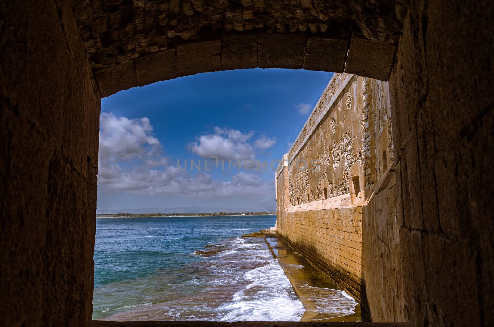 Detail of the wall on the sea of medieval Maniace's Castle in Siracusa