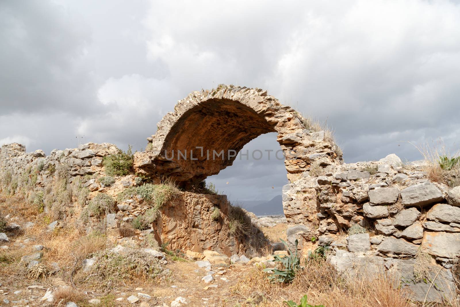 View of historical old area in Anemurium ancient city in Mersin, on cloudy blue sky background.