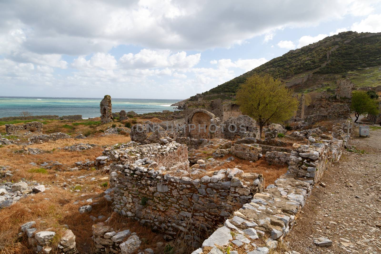 View of historical old area in Anemurium ancient city in Mersin, on cloudy blue sky background.