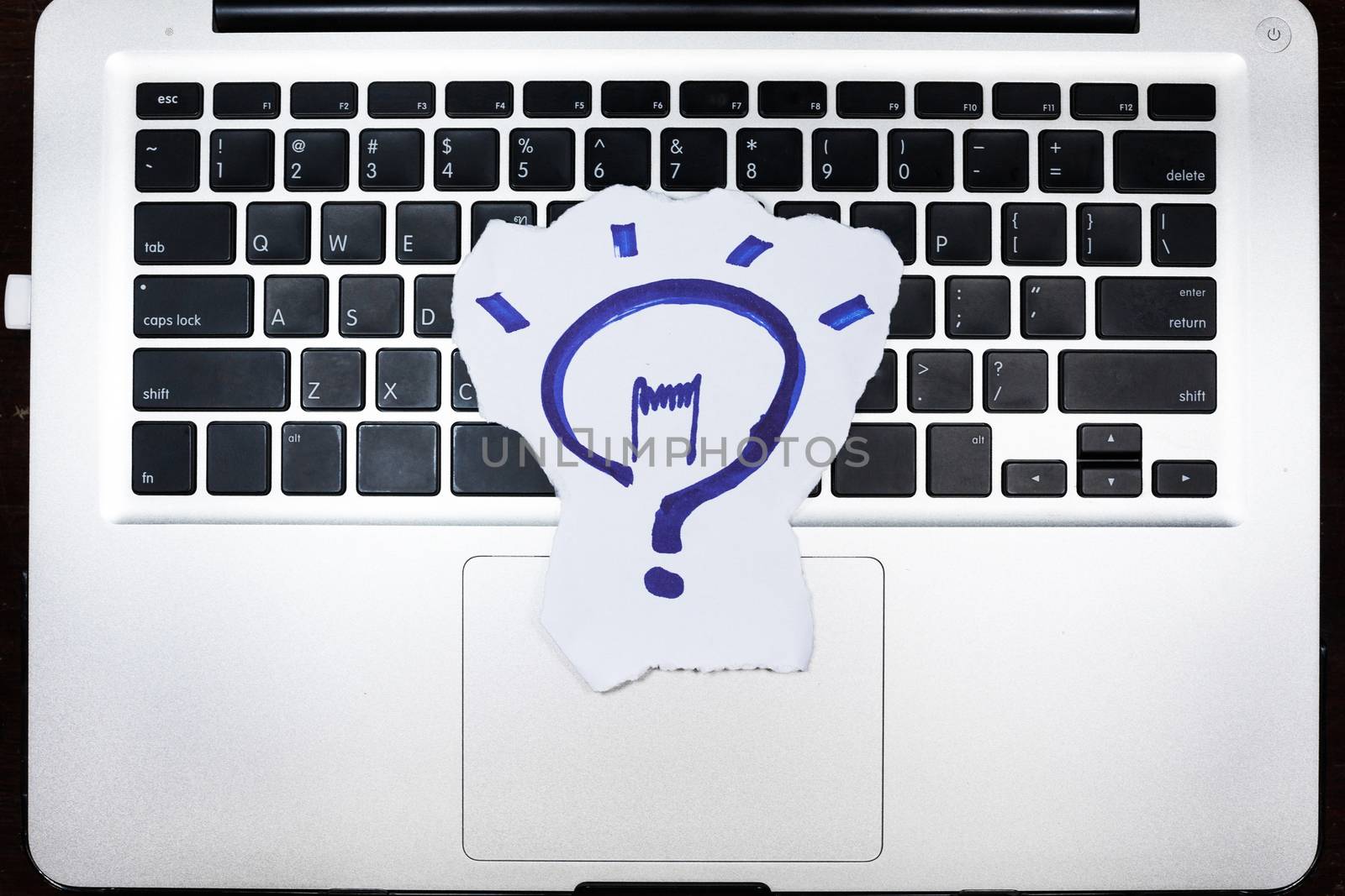 business, education, idea, inspiration and people concept - close up of female hands with paper sheet on computer keyboard