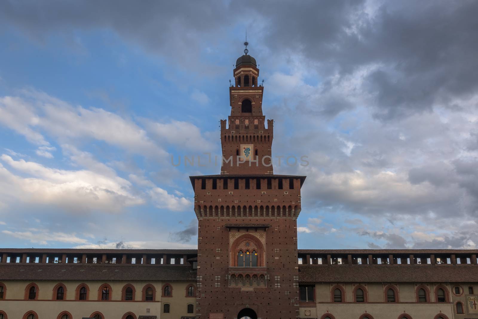 Tower of the Sforza Castle (Castello Sforzesco), a castle in Milan, Italy at twilight.