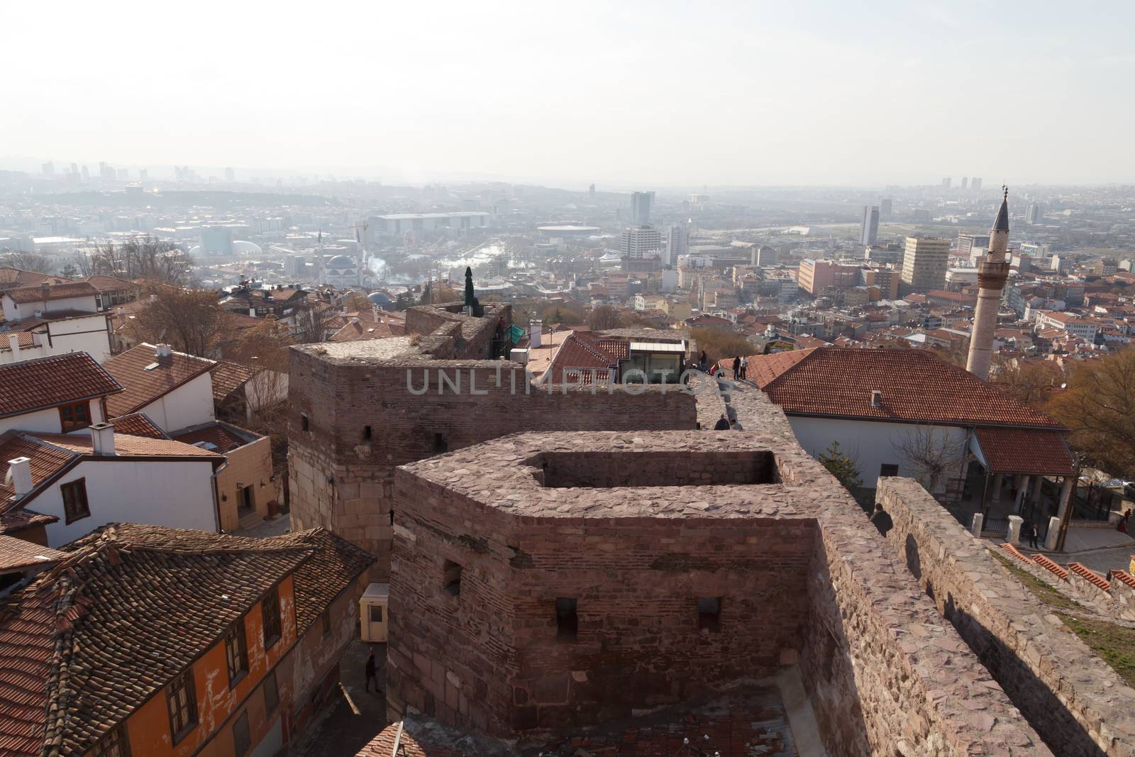 Cityscape view with old small houses from historical Ankara Tower on cloudy sky background.