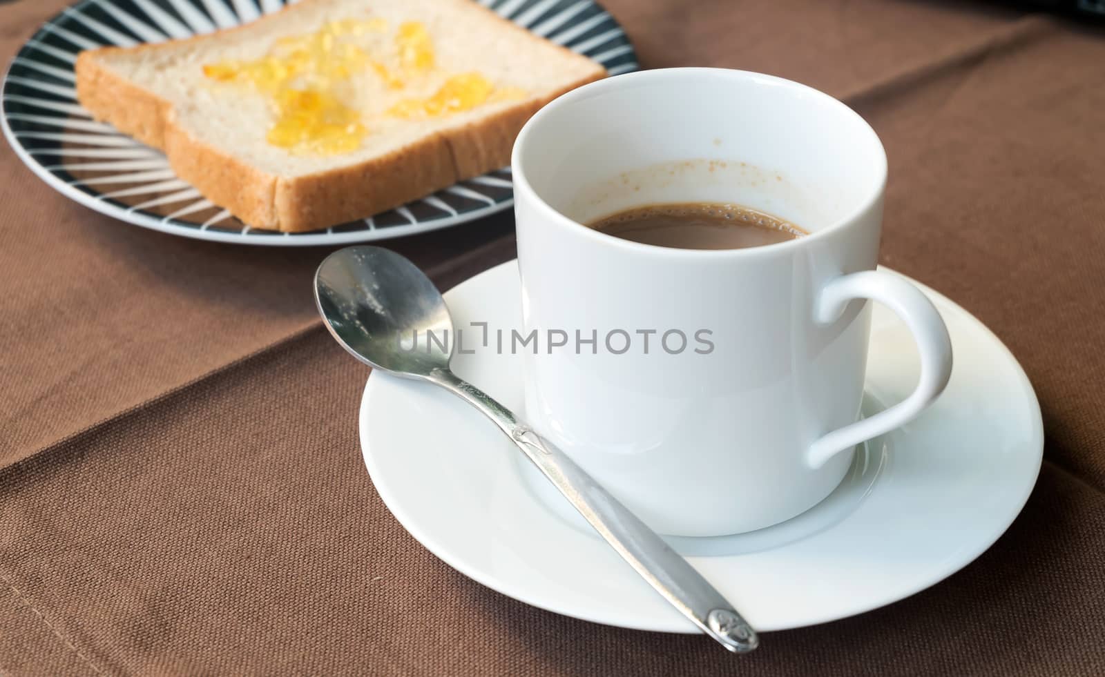 Bread and coffee on the table.