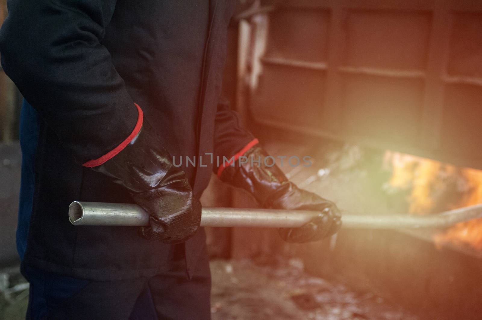 Industrial worker in metal melting factory