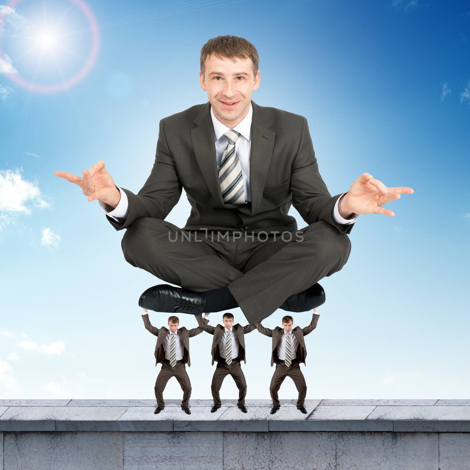 Young businessman sitting in lotus posture by cherezoff