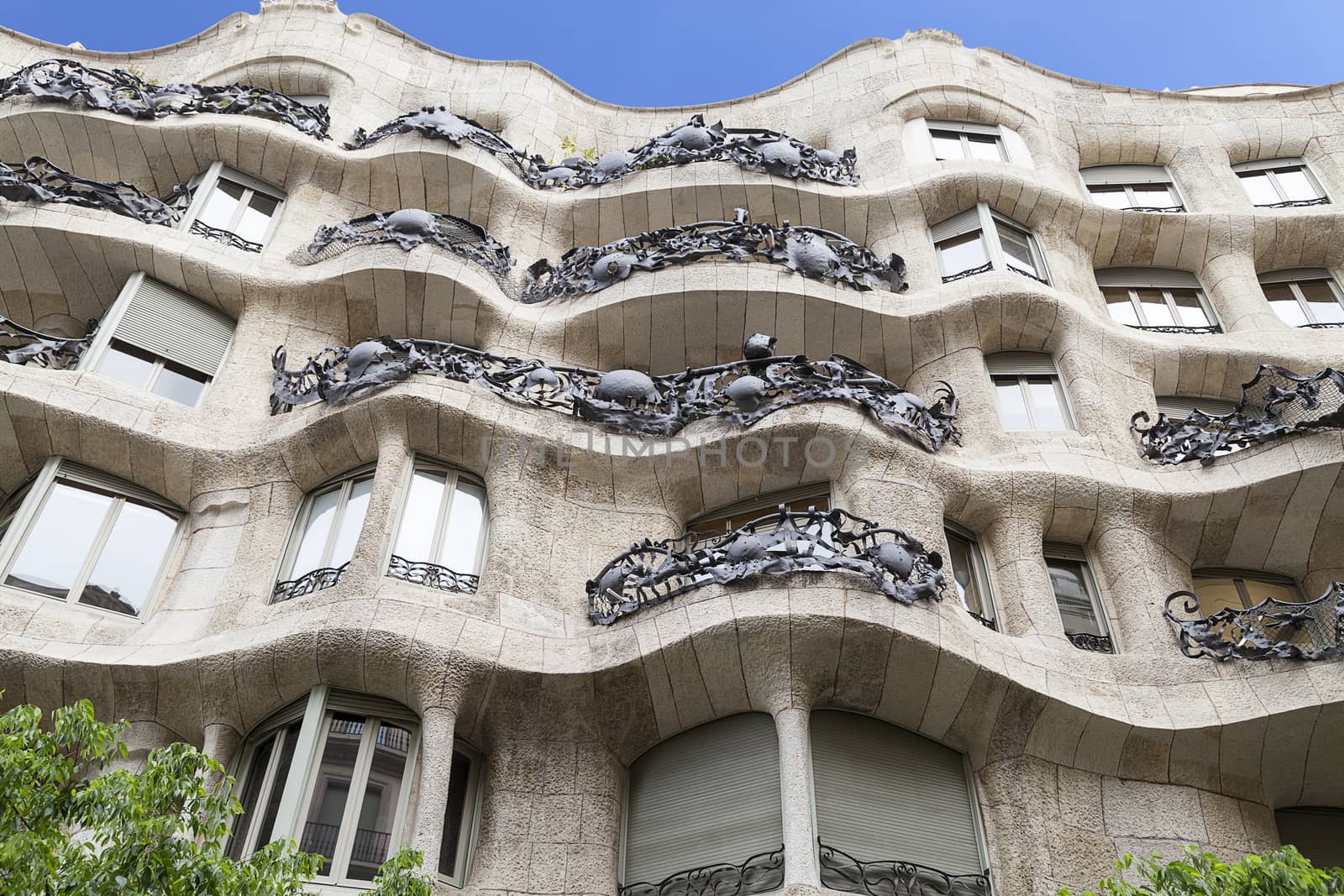  Casa Mila known as La Pedrera - facade with balconies of modernist building designed by Antoni Gaudí,  Barcelona, Spain