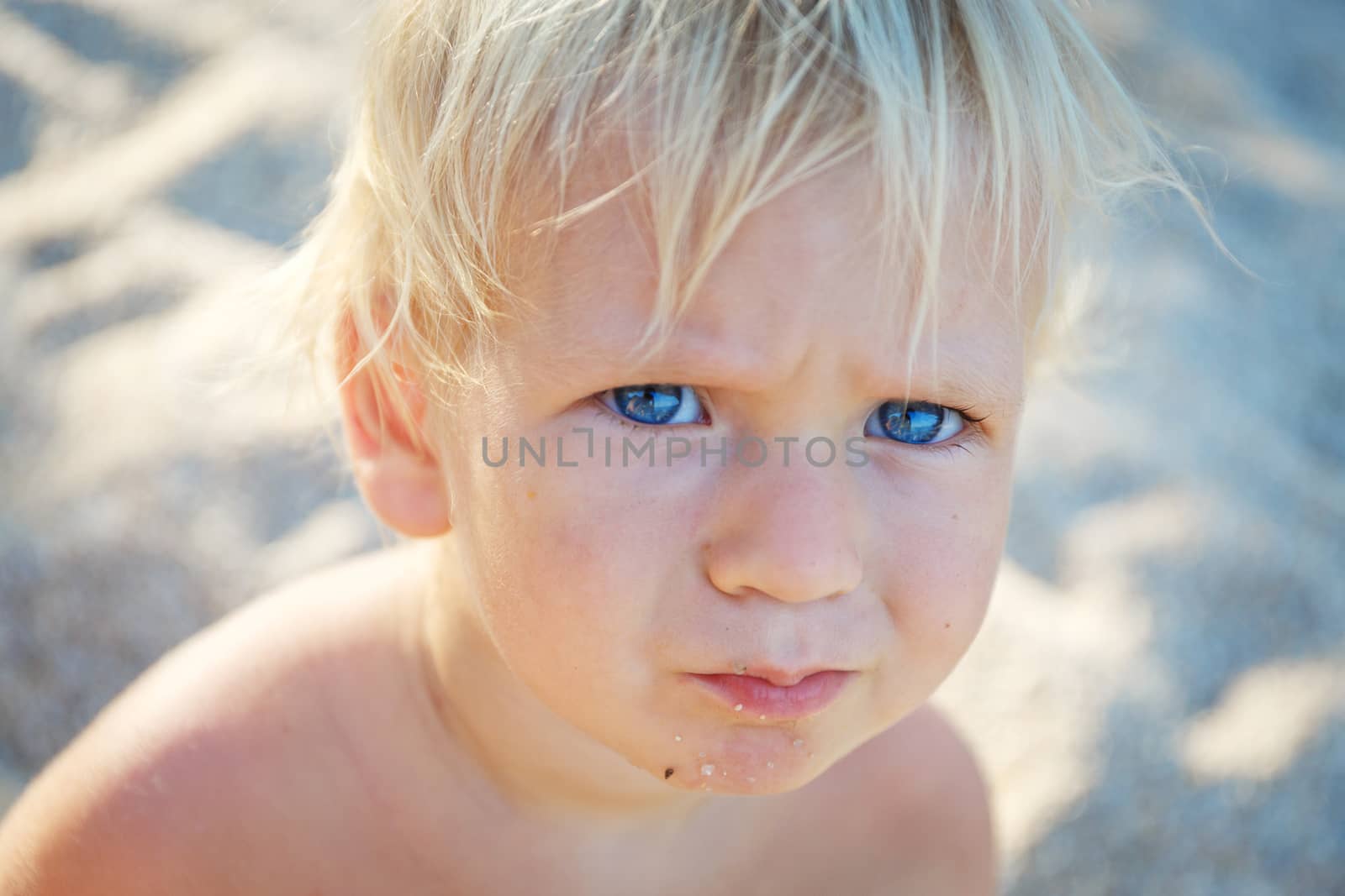 little toddler with blue eys in thailand beach