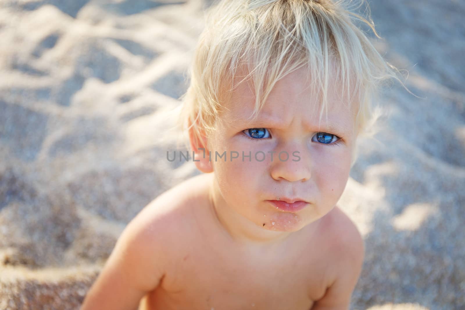 little toddler with blue eys in thailand beach