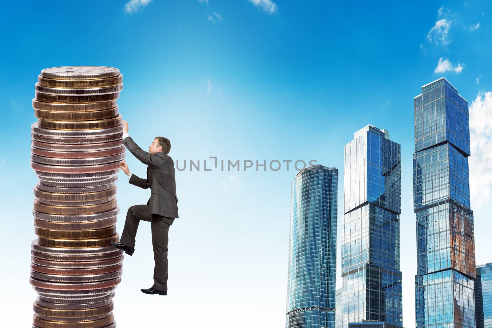 Businessman climbing up a huge stack of coins by cherezoff