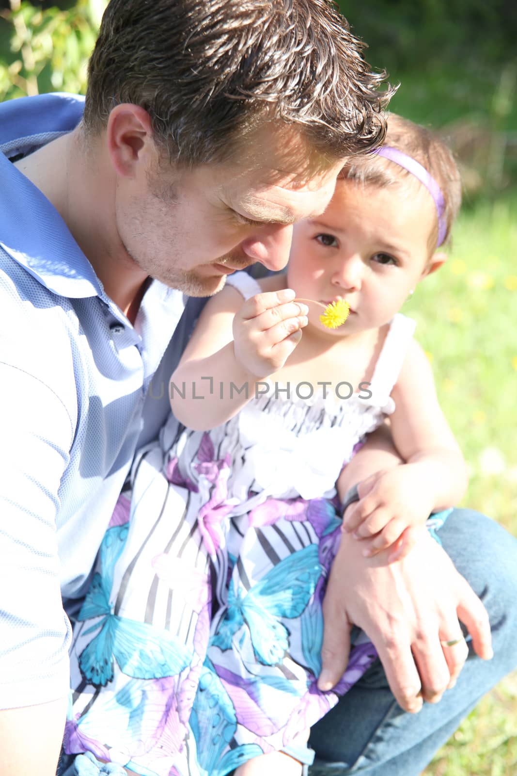 Father and daughter outside in the field