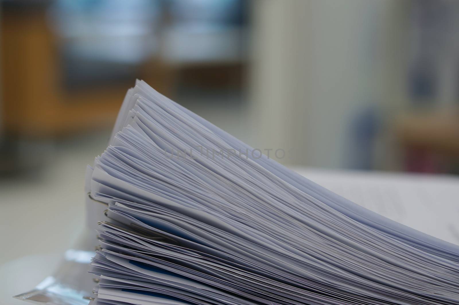 Stack of data document was organized by clipping and placed in office.