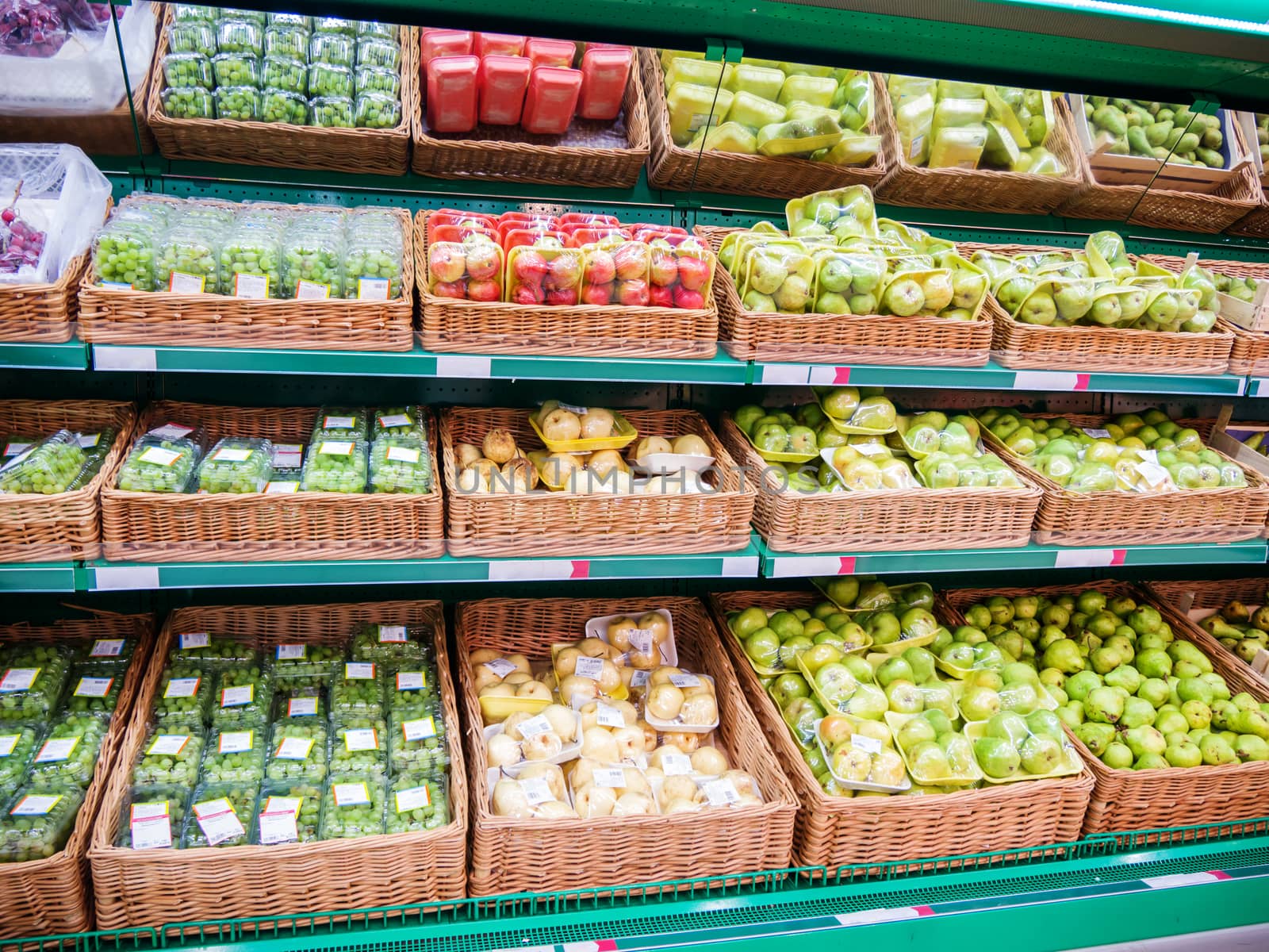 Fresh fruits on shelf in supermarket by fascinadora