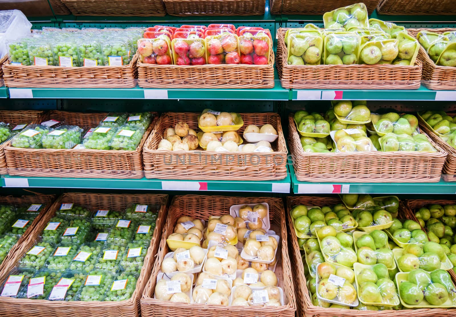 Fresh fruits on shelf in supermarket by fascinadora