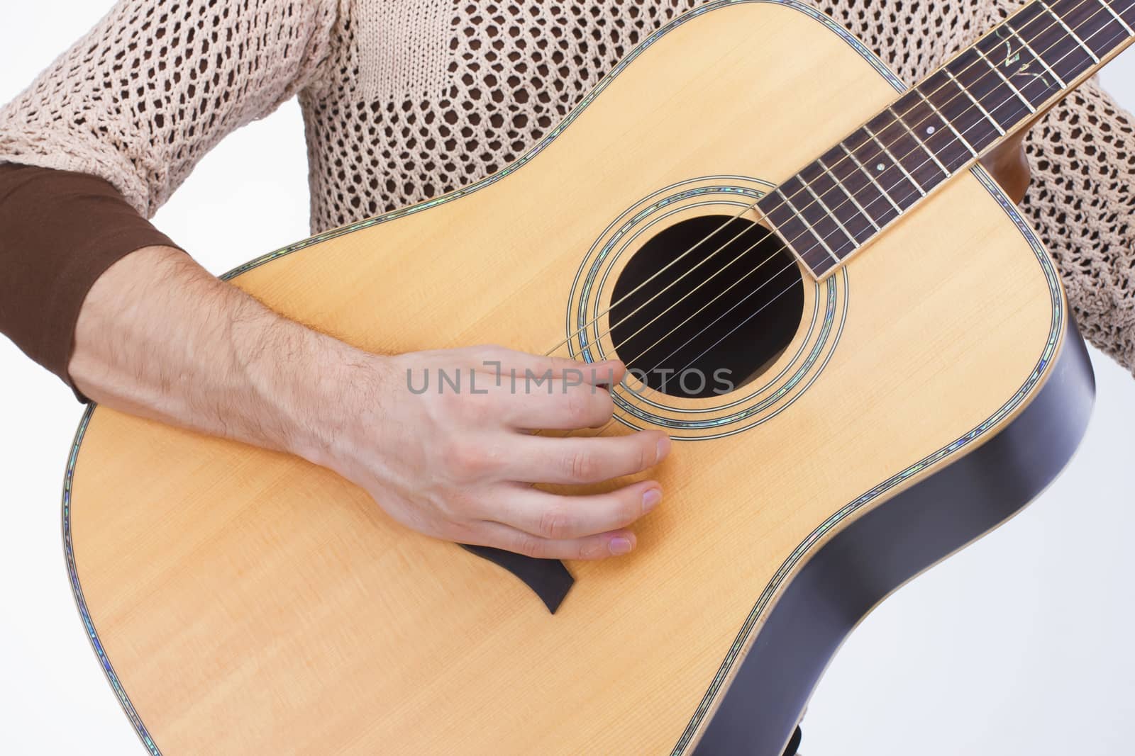 guitar hand of guitarist playing guitar yellow