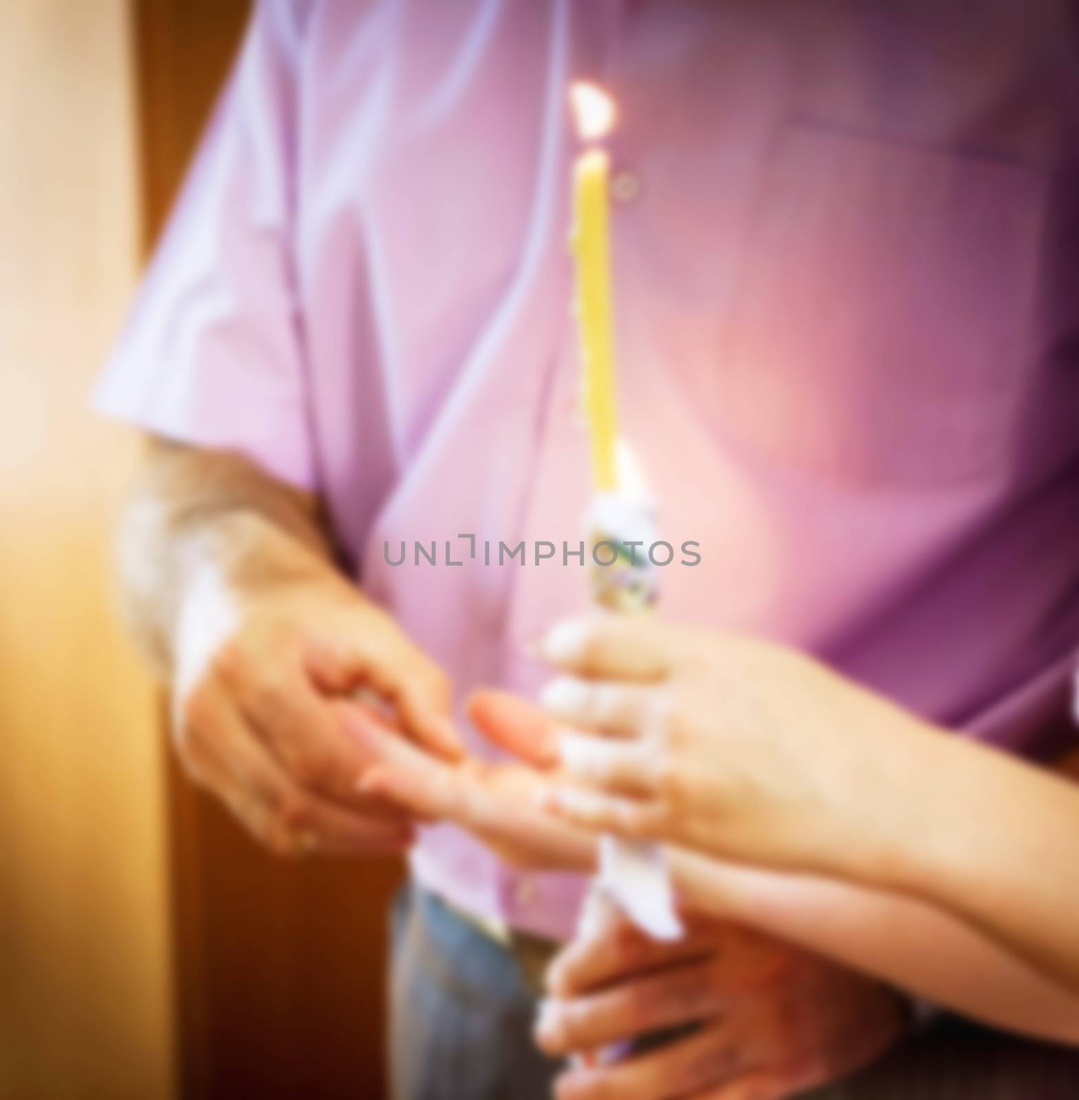 Wedding in the Church of the Christian and Catholic wedding ceremony, the husband puts on a wedding ring to his wife, a religious wedding white church, blurred