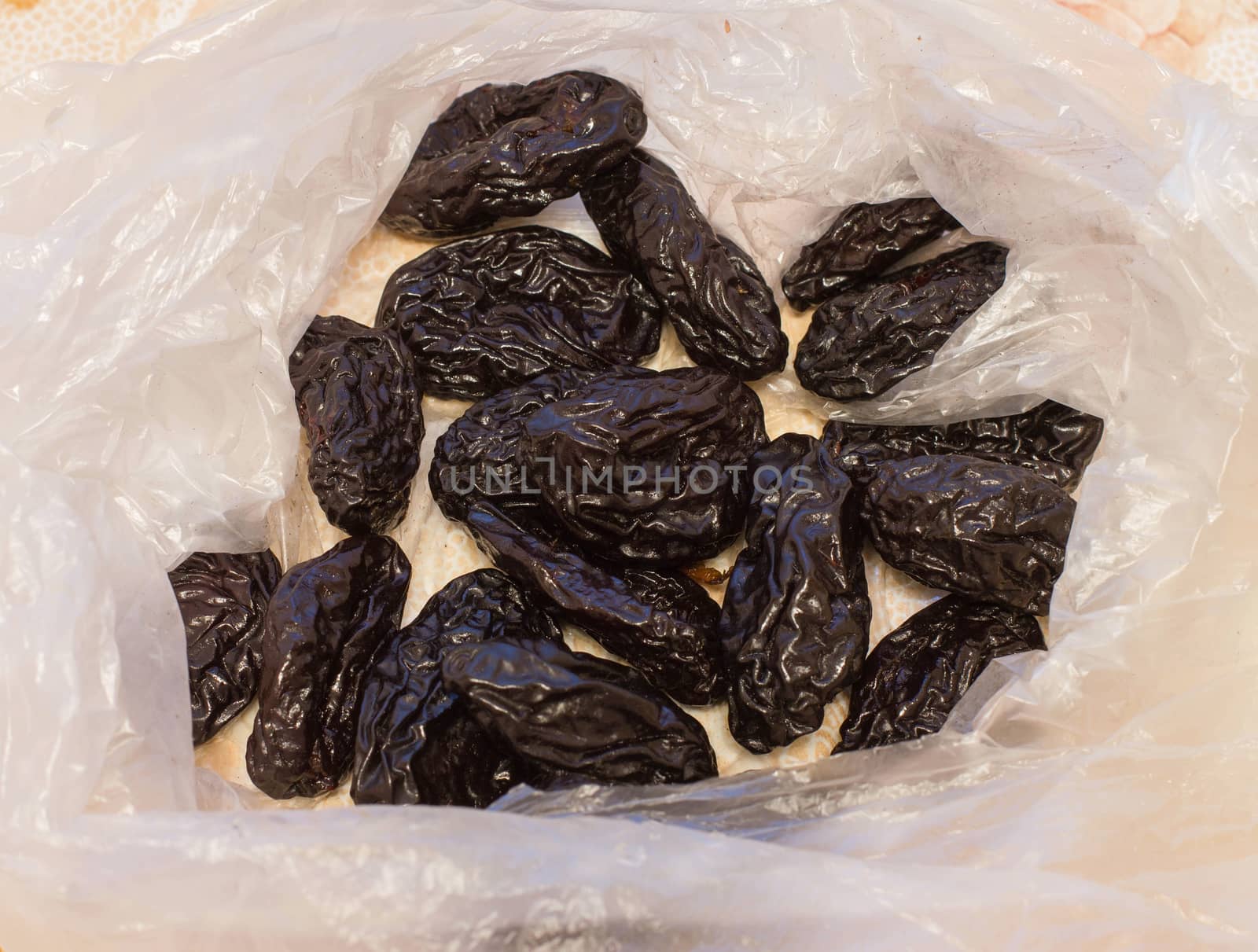 prunes, a handful of dried fruits close-up