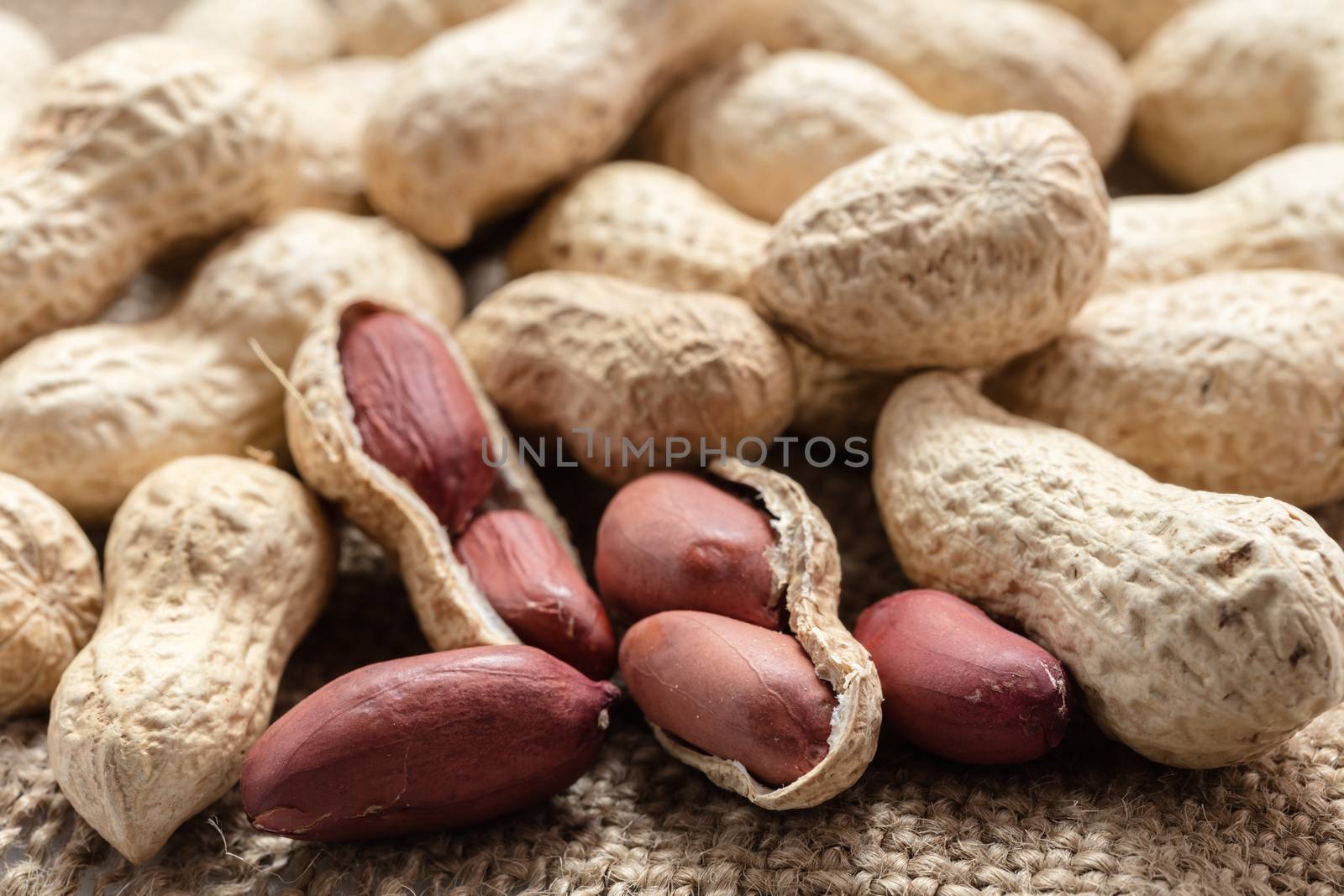 groundnut in the skin close-up on vintage background