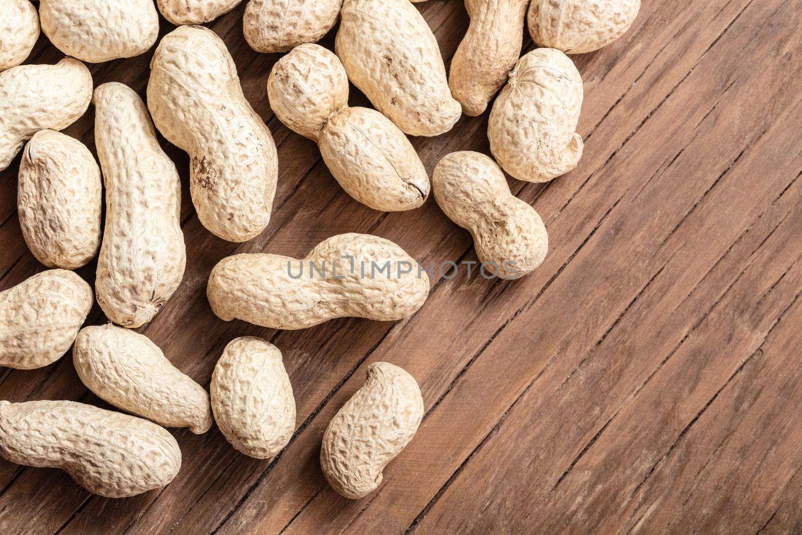 groundnut in the skin close-up on a wooden background