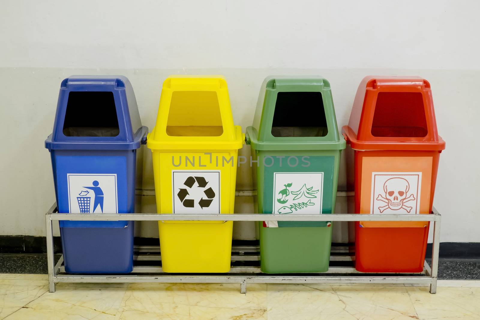 Different Colored wheelie bins set with waste icon by art9858