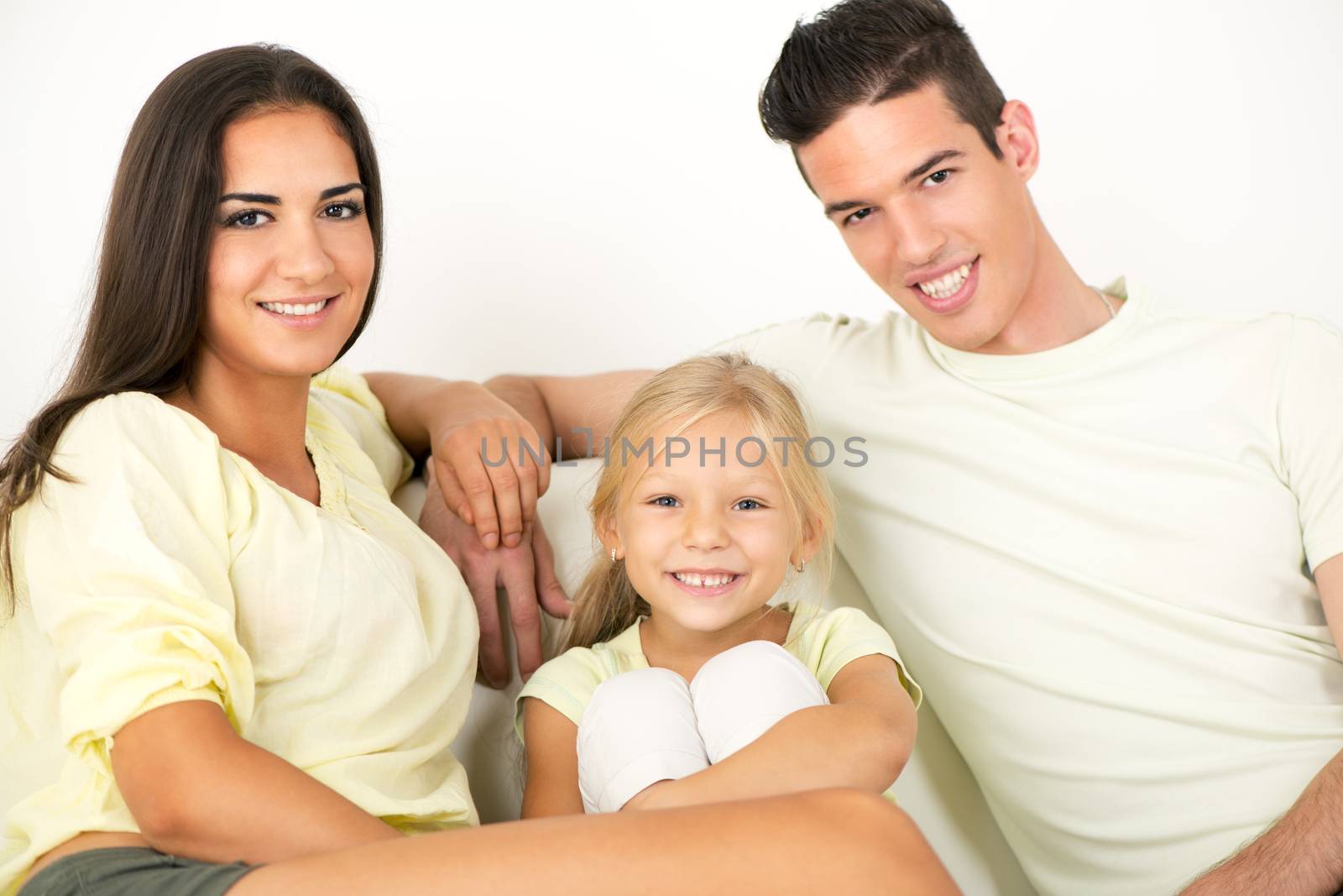 Portrait of a beautiful Happy family sitting at home